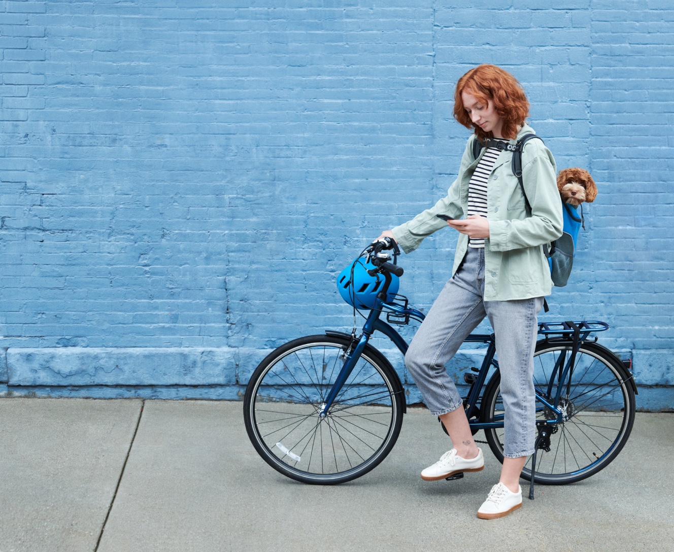 Woman on a bike using her ADT app Woman on a bike using her ADT app
