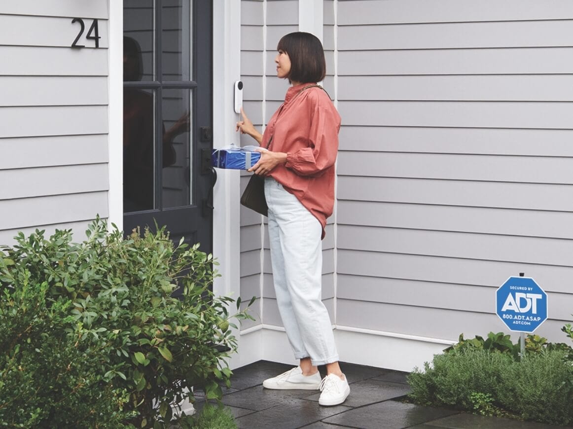 Woman Ringing Nest doorbell