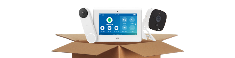 Google doorbell camera,  ADT command panel, and ADT indoor camera inside a cardboard box