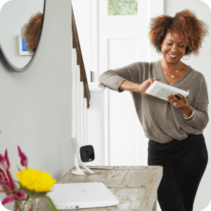 Woman setting up her security system