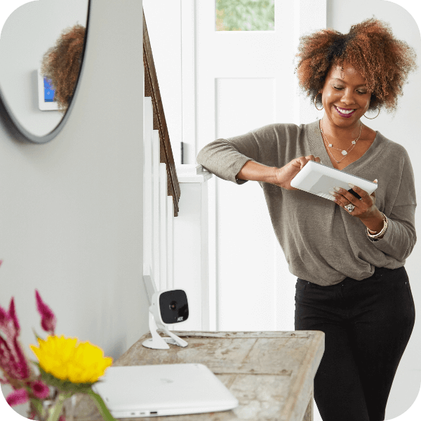 Woman setting up her security system