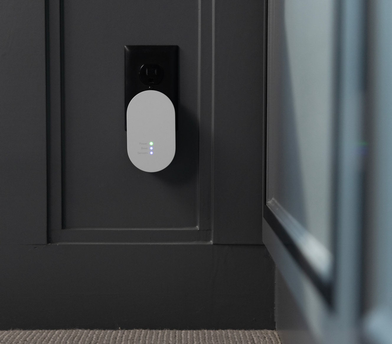 ADT Alarm Range Extender plugged in with LED indicators on