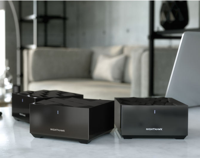 Three Netgear Mesh WiFi devices on a marble countertop Three Netgear Mesh WiFi devices on a marble countertop