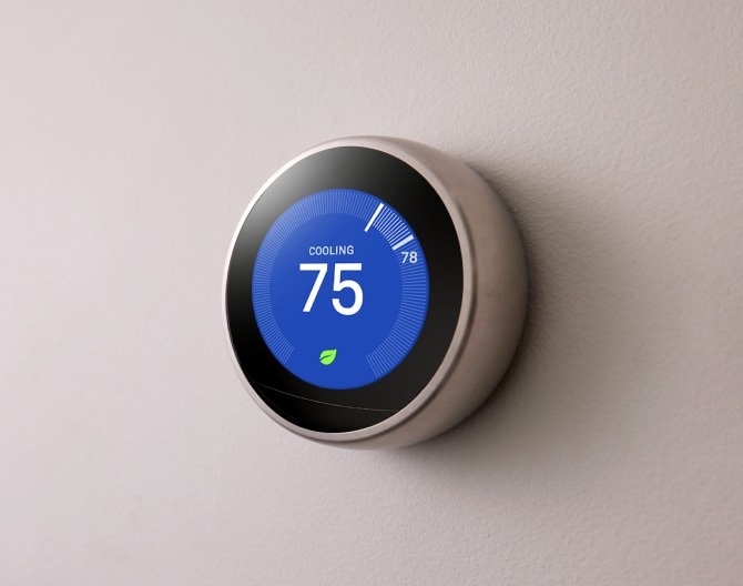 Google Nest Learning Thermostat on a wall Google Nest Learning Thermostat on a wall