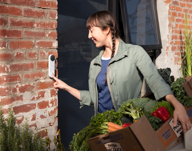 Delivery worker ringing the Google Nest Doorbell to someone's home