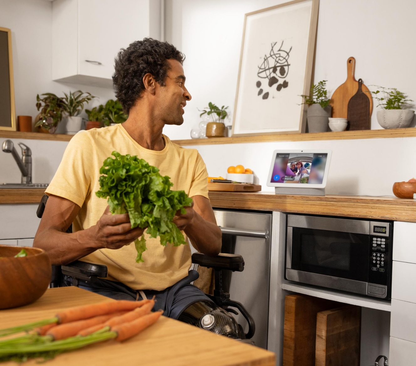 Man using his Google Nest Hub Max to see his live Google Nest Cam footage