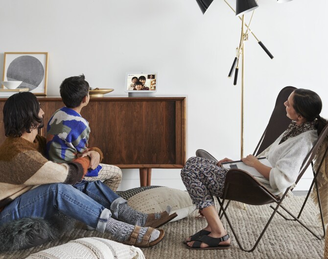 Family doing a Google Meet video call on their Google Nest Hub Max