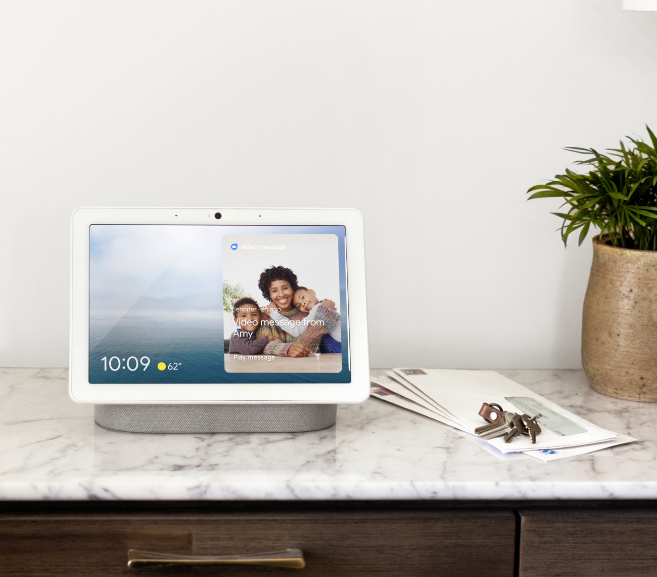 Google Nest Hub Max showing the home screen on a countertop 