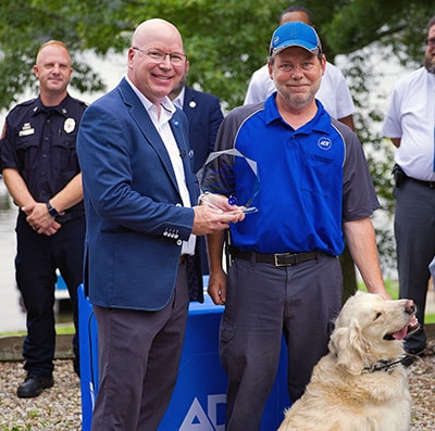 Derek Fiebig gives ADT Tech, Jeff Arkles the ADT Lifesaver Award.